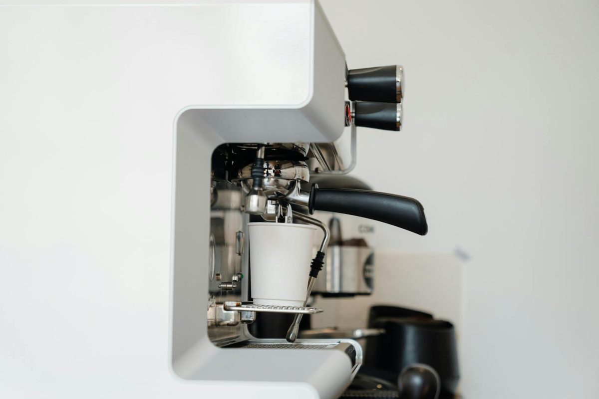 photo of white cup on espresso machine