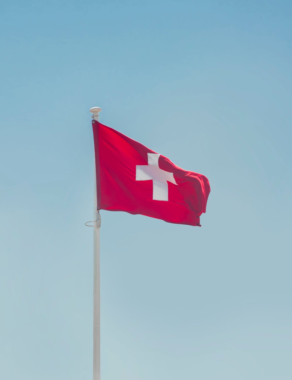 switzerland national flag hanging on pole