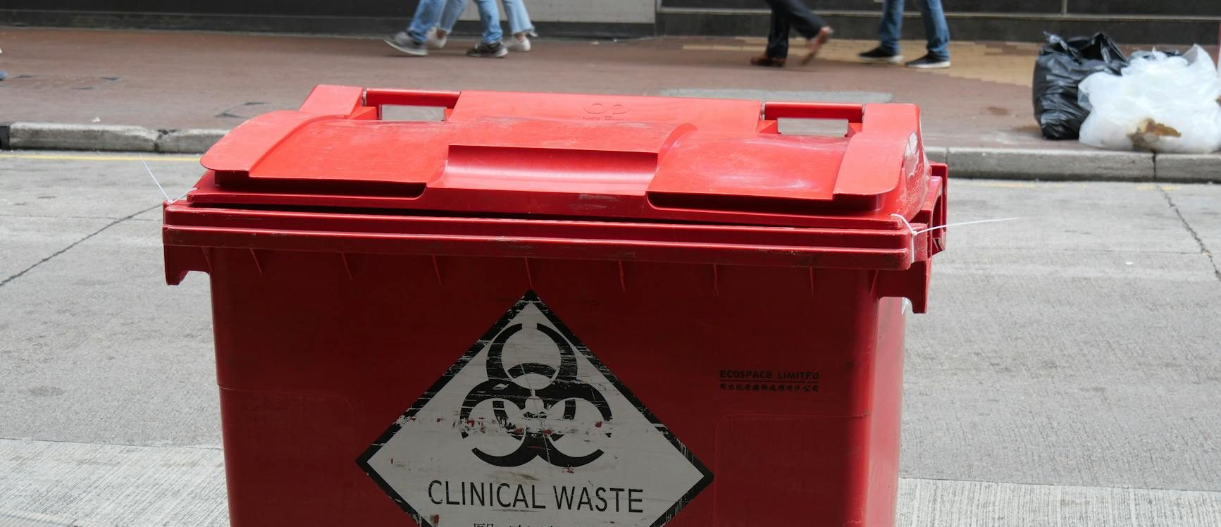 wheeled trash bin on the street