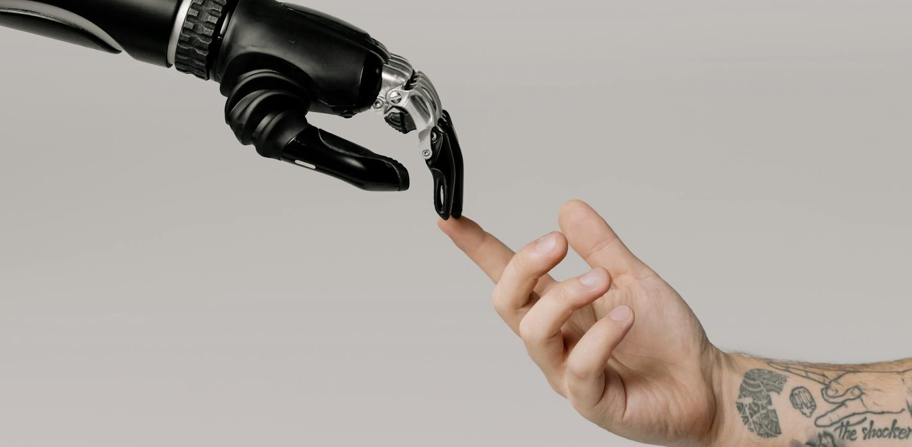 bionic hand and human hand finger pointing