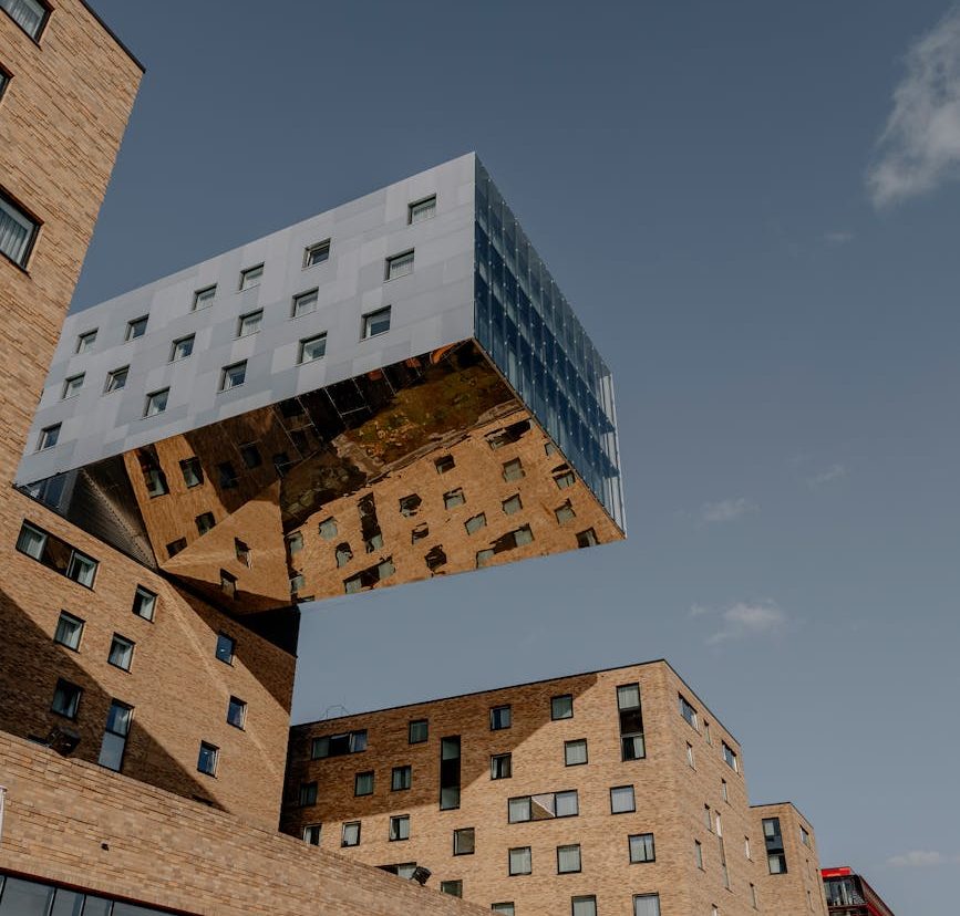 brown concrete building under blue sky
