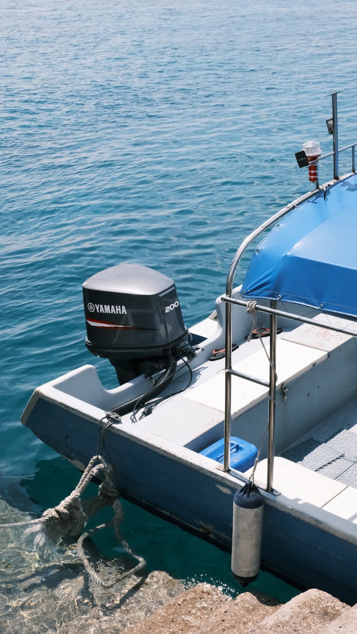 sunlit moored motorboat