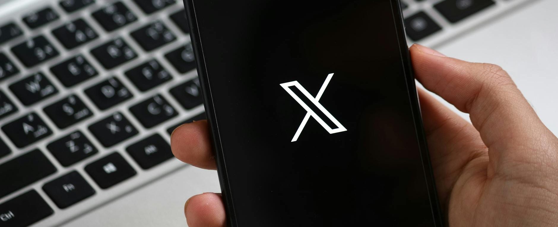 person holding smartphone with modern app interface