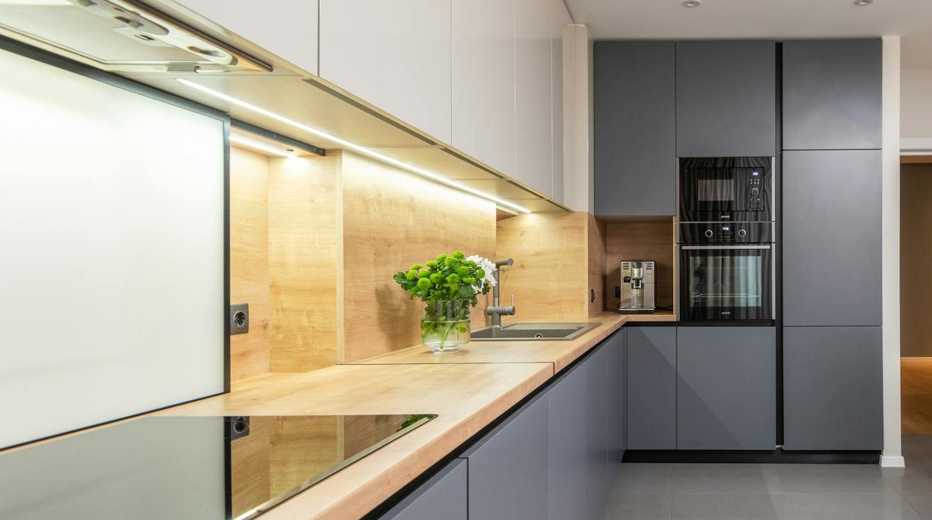 modern kitchen interior with electric stove and appliances at home