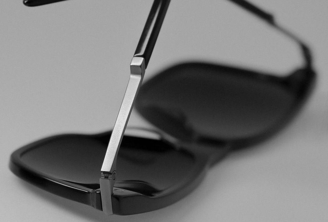 sleek black sunglasses on smooth surface