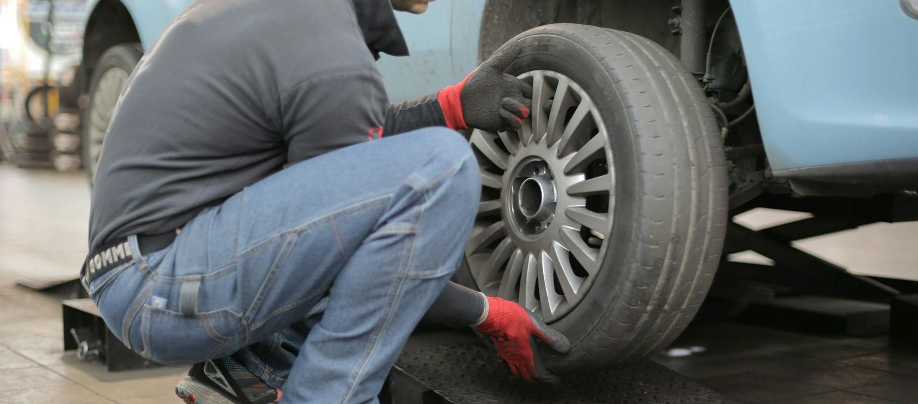 man changing a car tire