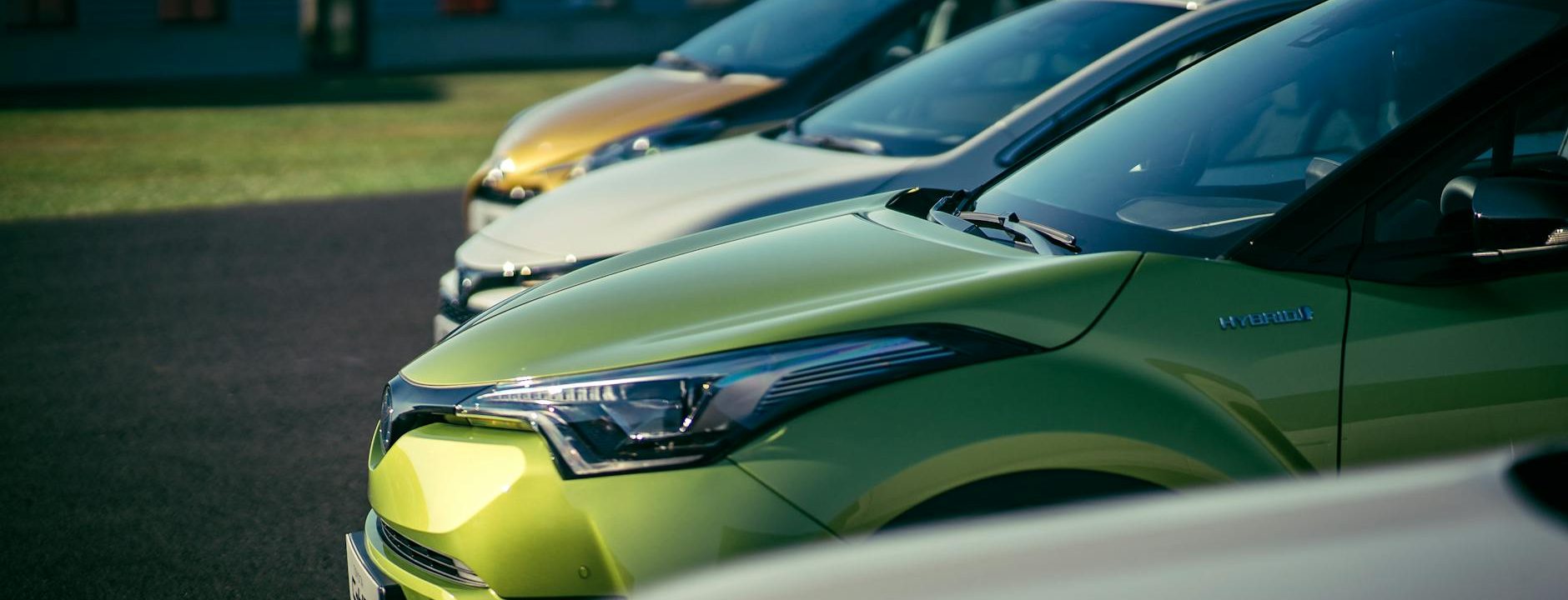 lined up parked cars on the road