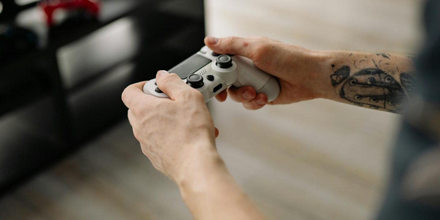 close up shot of person holding a game controller