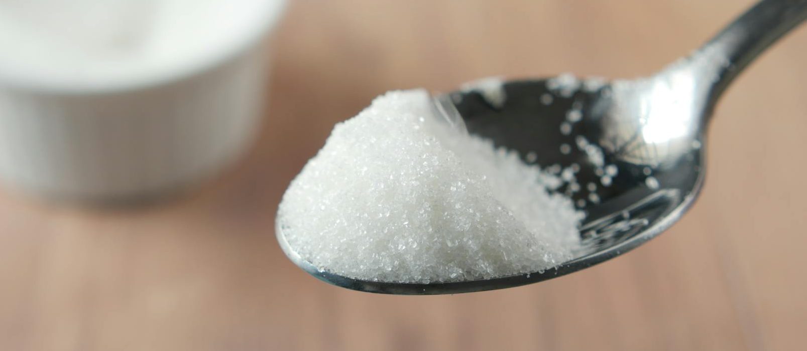 sugar in metal spoon
