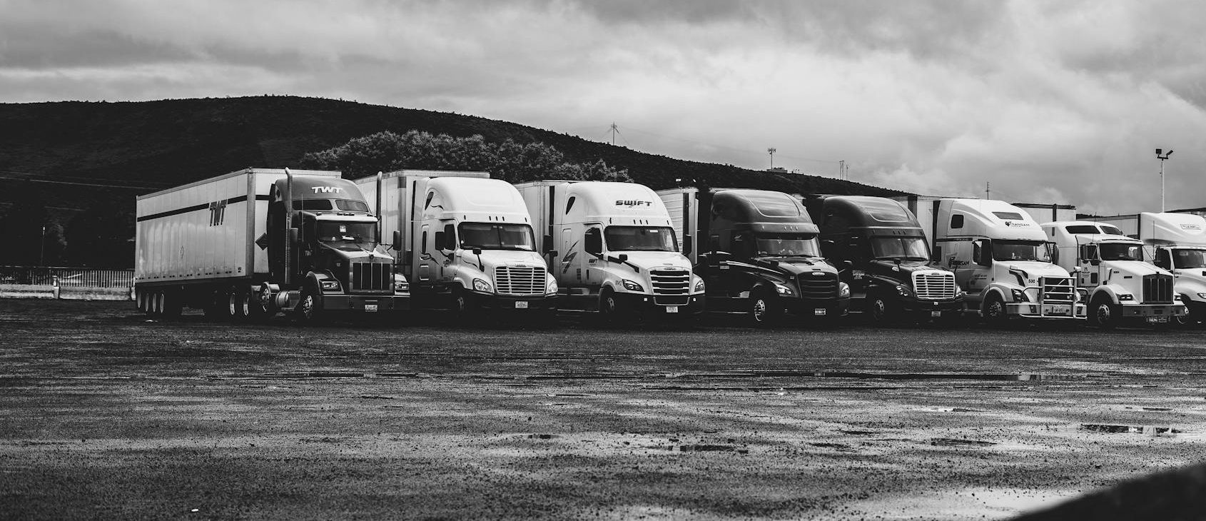 parked trucks under clouds