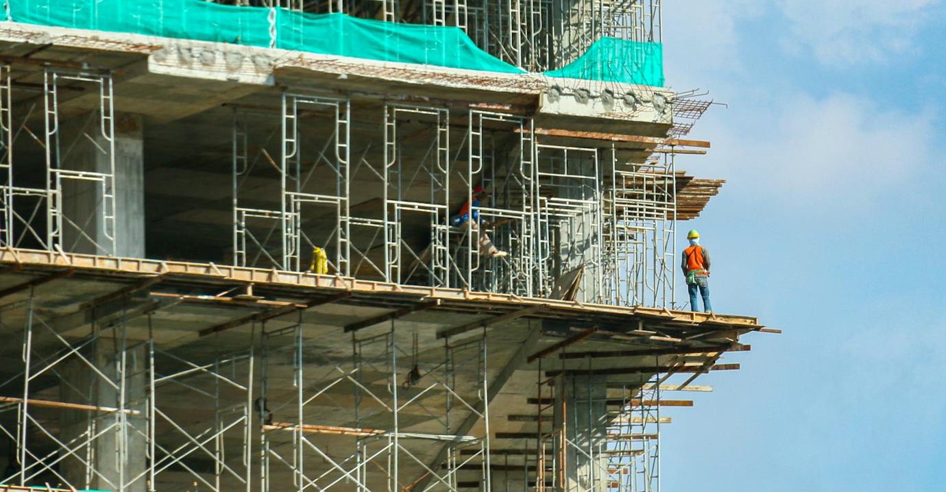 a construction worker standing in a construction site