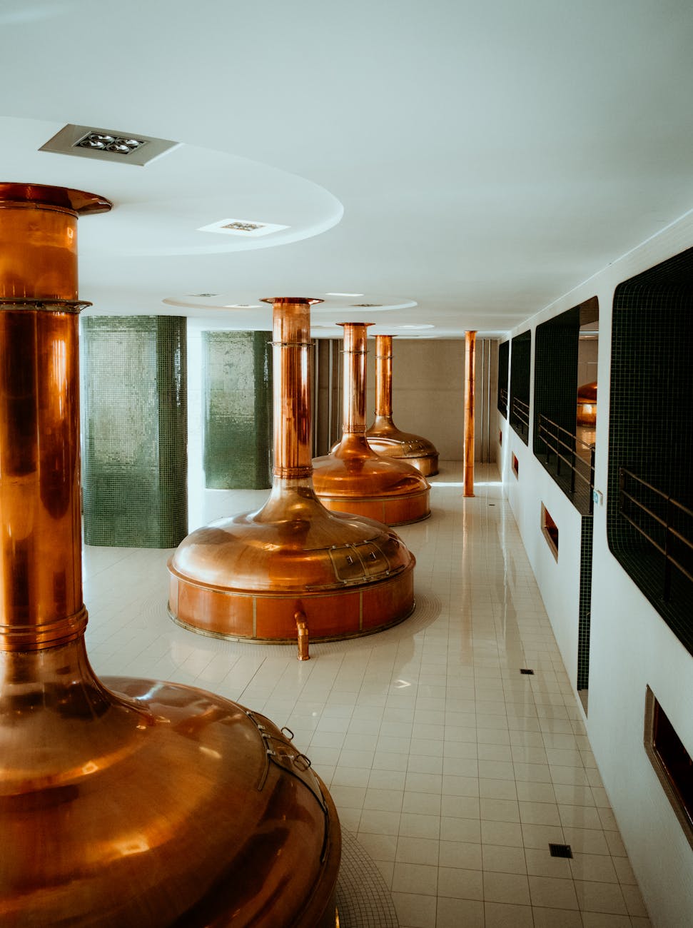 copper brewing vats in pilsen brewery interior