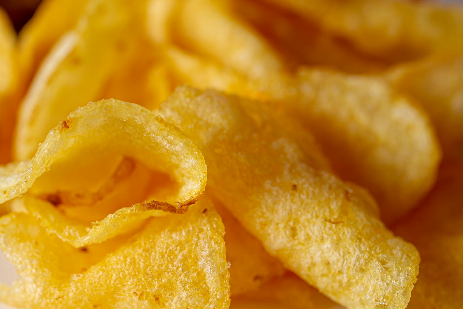 close up of crispy golden potato chips