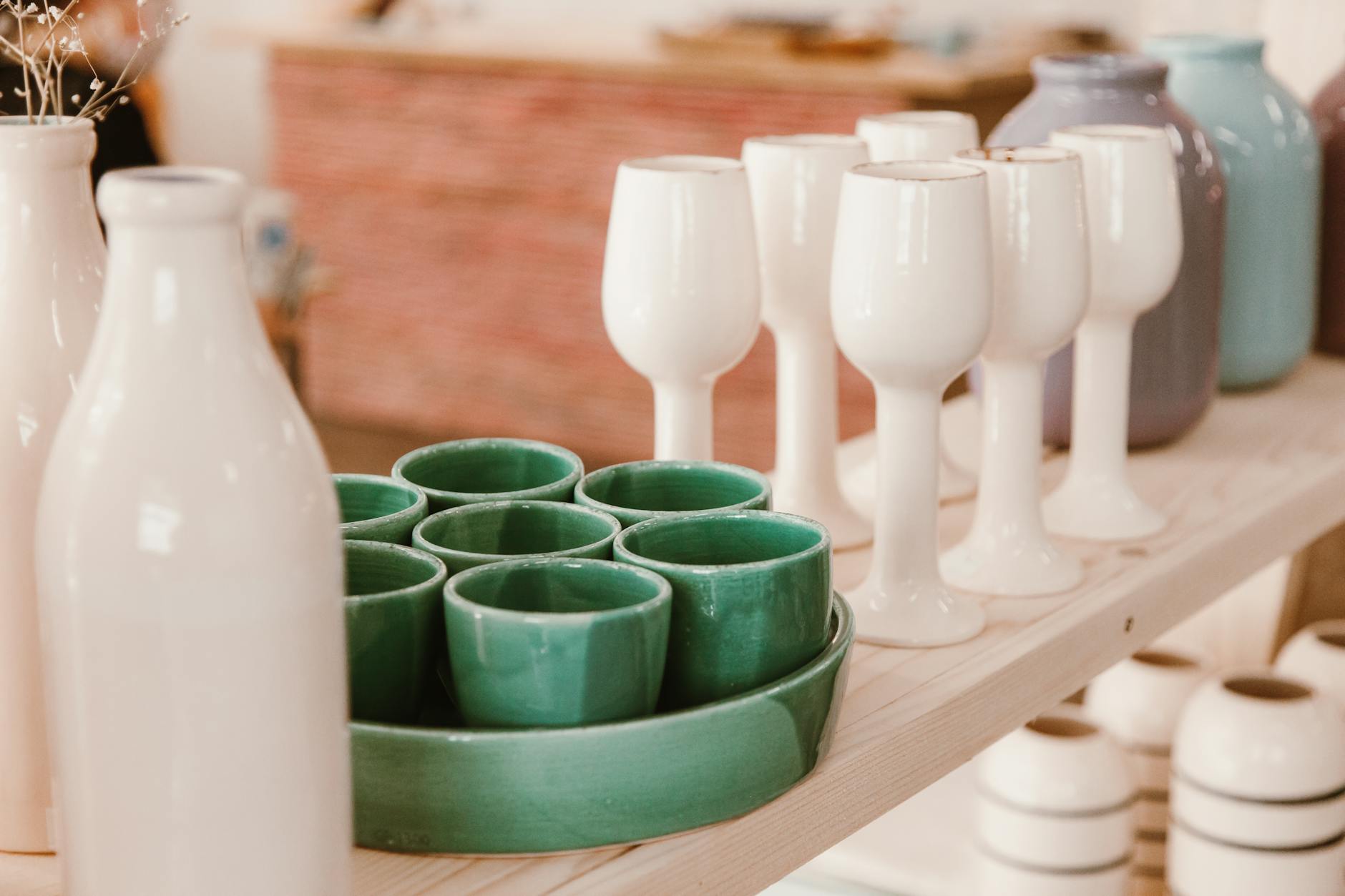 a variety of ceramic vases and cups